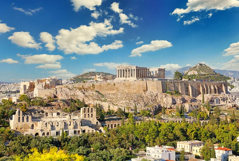 Acropolis of Athens with Parthenon and Odeon under summer clouds