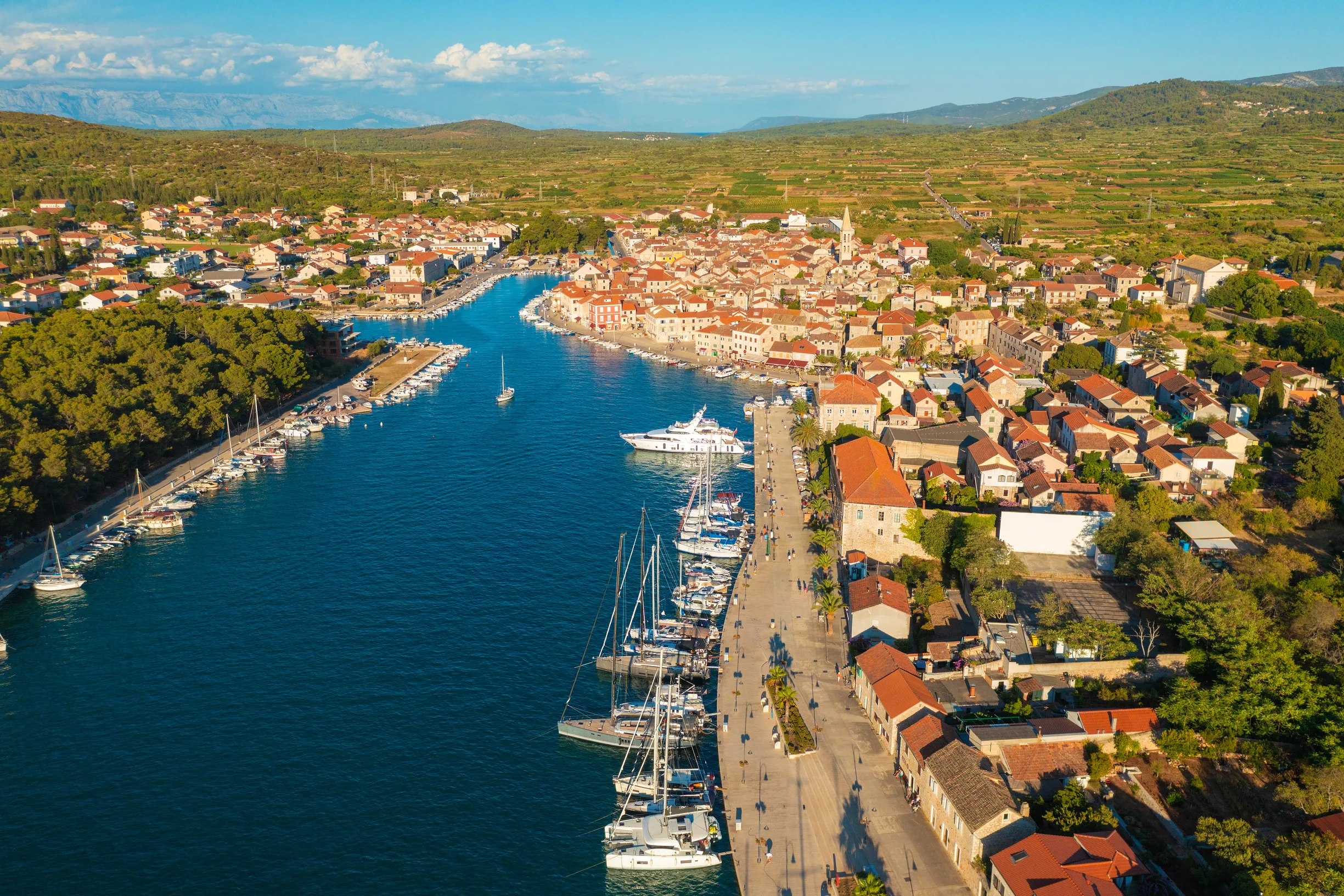 Aerial of Stari Grad on Hvar with yachts moored along old town quay
