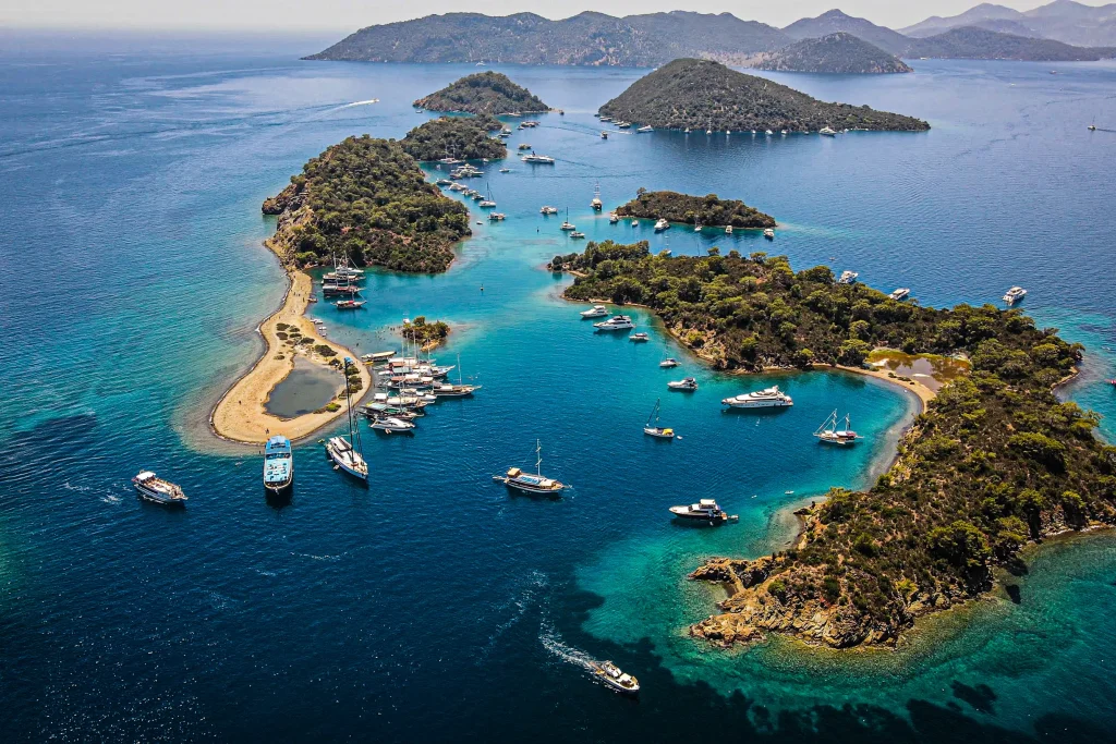 Aerial of Gocek Yassica islets with sandbar and many anchored boats