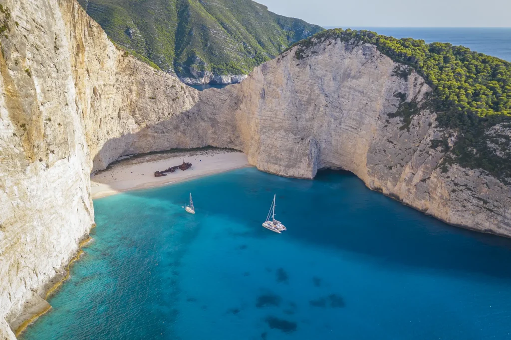 Aerial of Navagio shipwreck beach between towering cliffs, Zakynthos