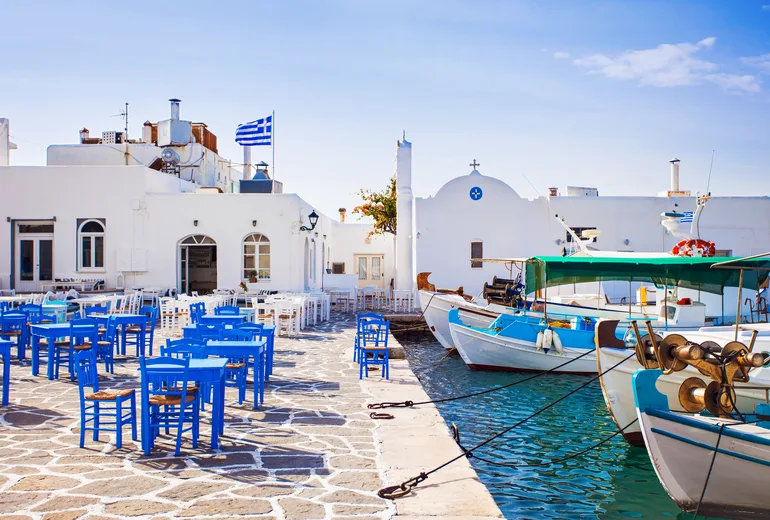 Taverna tables on the old port quay at Naoussa on Paros